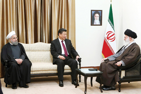 TEHRAN: Supreme Leader Ayatollah Ali Khamenei (right) meets Chinese President Xi Jinping as Iranian President Hassan Rouhani looks on yesterday. — AP