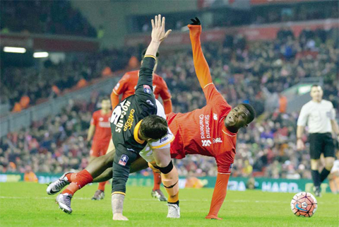 LIVERPOOL: Liverpool’s Sheyi Ojo (right) fights for the ball against Exeter’s Will Hoskins during the English FA Cup third-round replay soccer match between Liverpool and Exeter at Anfield Stadium, Liverpool on Wednesday Jan 20, 2016. — AP