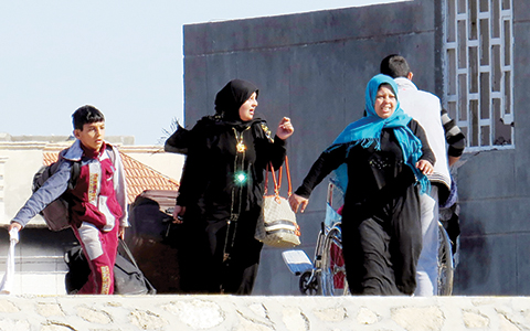 Residents leave their homes as Iraqi security forces clear the Sufiya district on the outskirts of Ramadi on January 15, 2016, a few weeks after declaring victory against the Islamic State (IS) group.n IS fighters had planted thousands of roadside bombs and booby traps across the city, slowing the advance of ground forces vastly outnumbering them and supported by air strikes from the Iraqi air forces and US-led coalition.n / AFP / MOADH AL-DULAIMI