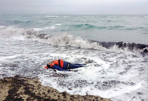 IZMIR: The body of a migrant lies on the beach in Dikili, Izmir, Turkey yesterday. — AP