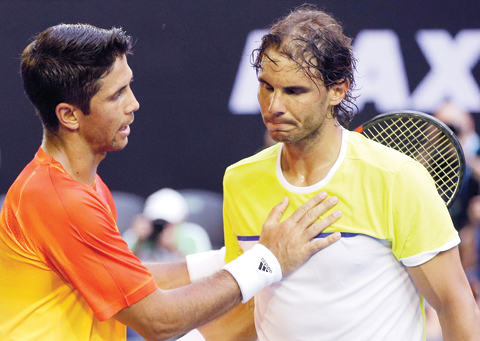MELBOURNE: Rafael Nadal (right) of Spain is consoled by compatriot Fernando Verdasco after his first round loss to Verdasco at the Australian Open tennis championships in Melbourne, Australia yesterday. — AP
