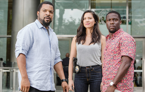 This photo provided by Universal Pictures shows, Ice Cube, from left, as James Payton, Olivia Munn as Maya Cruz, and Kevin Hart as Ben Barber in a scene from the film, “Ride Along 2.”