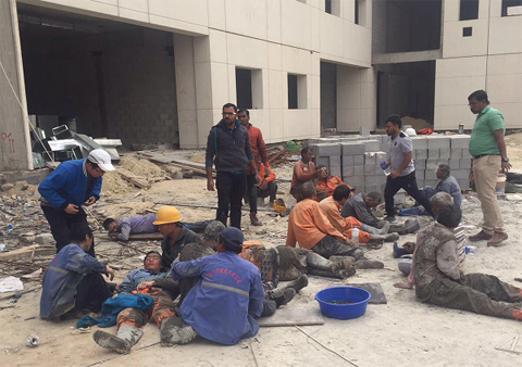 KUWAIT: Injured workers are seen after an under-construction school building collapsed