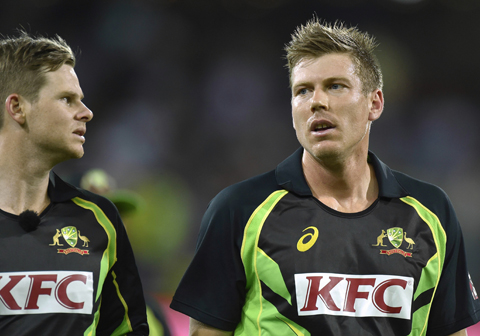 ADELAIDE: Steven Smith (L) and James Faulkner of Australia are pictured during the first Twenty20 cricket international between India and Australia at the Adelaide Oval in Adelaide on Tuesday. — AFP