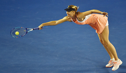 TOPSHOT - Russia's Maria Sharapova returns against Lauren Davis of the US during their men's singles match on day five of the 2016 Australian Open tennis tournament in Melbourne on January 22, 2016. AFP PHOTO / SAEED KHAN-- IMAGE RESTRICTED TO EDITORIAL USE - STRICTLY NO COMMERCIAL USE / AFP / SAEED KHAN