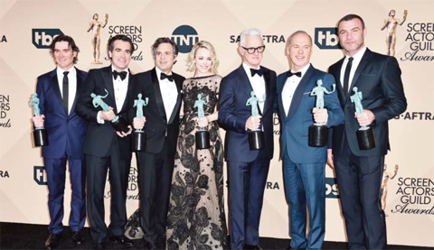 The cast of “Spotlight,” from left, Billy Crudup, Brian d’Arcy James, Mark Ruffalo, Rachel McAdams, John Slattery, Michael Keaton and Liev leading role for “Room”. Schreiber pose in the press room with the award for outstanding cast in a motion picture for “Spotlight”.