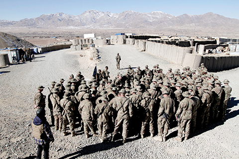 FILE - In this Dec. 25, 2013 file photo, U.S. troops gather in to Wardak province, eastern Afghanistan. Conditions in Afghanistan are getting worse, 15 years into a war that few Americans talk about any more. That’s preventing the clean ending that President Barack Obama hoped to impose before leaving office. Violence is on the rise, the Taliban are staging new offensives, the Islamic State group is angling for a foothold and peace prospects are dim. (AP Photo/Rahmat Gul, File)