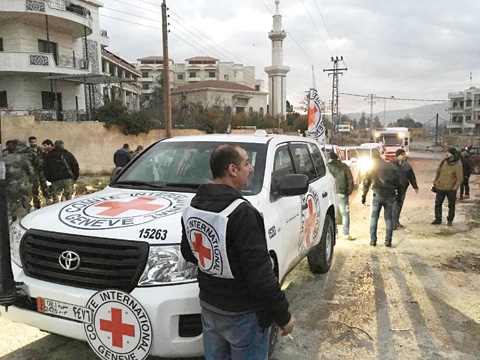 MADAYA, Syria: A convoy containing food, medical items, blankets and other materials is delivered to this besieged town yesterday. — AP