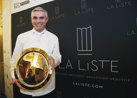 In this Dec 17, 2015 file photo, French Swiss Chef Benoit Violier of the restaurant Hotel de Ville in Crissier, Switzerland, poses with his trophy for the best restaurant of the World during the award ceremony of “La Liste” (The List) at the French Foreign Ministry in Paris