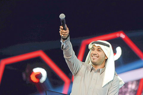 Photo shows Ismael Moubarak perform on stage