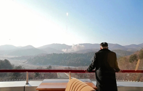 North Korean leader Kim Jong-Un looks at the rocket launch of earth observation satellite Kwangmyong 4 yesterday.  - AFP 