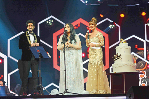 (From left) Photo shows actor Mohmoud bo Shihri, Ahlam and Youmna Shirri on stage