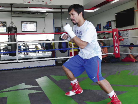 MINDANAO: This photo taken on February 15, 2016 shows Philippine boxing icon Manny Pacquiao wearing shorts and shoes with Nike logos during his training session at a gym in General Santos. — AFP