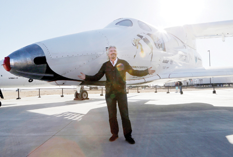 MOJAVE: In this Sept 25, 2013, file photo, British entrepreneur Richard Branson poses with the first SpaceShipTwo at a Virgin Galactic hangar at Mojave Air and Space Port. — AP photos