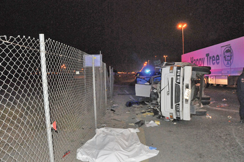 A victim’s body lies on the ground following an accident reported on Jahra Road on Saturday night.