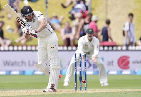 WELLINGTON: Doug Bracewell of New Zealand plays a shot during day four of the first cricket Test match between New Zealand and Australia at the Basin Reserve in Wellington  yesterday. - AFP