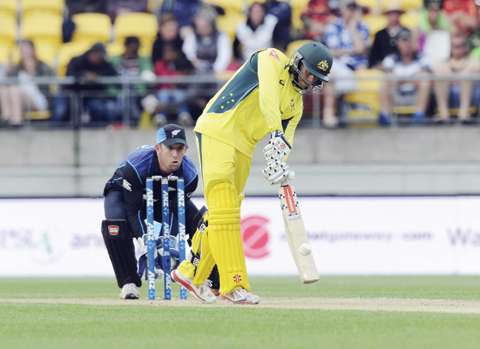 WELLINGTON: Australia's Usman Khawaja bats in front of New Zealand's Luke Ronchi in their second One Day International cricket match at Westpac Stadium in Wellington, New Zealand, yesterday. - APn