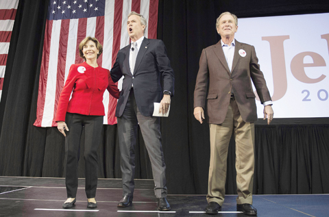 NORTH CHARLESTON, South Carolina: Former US President George W Bush (right), Republican presidential candidate Jeb Bush and former First Lady Laura Bush arrive during a campaign rally on Monday. - AFP