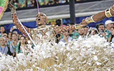 Revelers of Mangueira samba school perform.