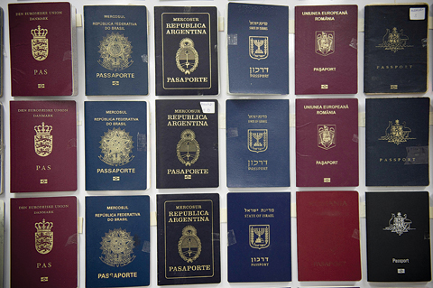 BANGKOK: Fake passports are displayed at the immigration bureau in Bangkok yesterday after Thai police broke up a major fake passport ring led by an Iranian known as 
