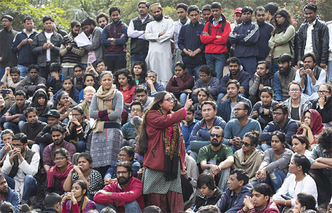 NEW DELHI: A student makes her speech as Jawaharlal Nehru University students gather for a protestnagainst the arrest of a student union leader in New Delhi, India yesterday. —AP