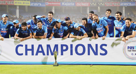 VISHAKAPATNAM: Members of the Indian cricket team celebrate with the winning trophy after their Twenty20 cricket series win against Sri Lanka, in Visakhapatnam, India, yesterday. India won the series 2-1.—AP