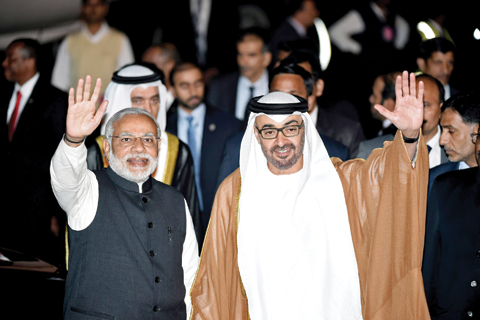 NEW DELHI: Indian Prime Minister Narendra Modi (left) and Crown Prince of Abu Dhabi Sheikh Mohammed bin Zayed Al-Nahyan wave to the crowd after the prince arrived at an air force base yesterday. — AFP