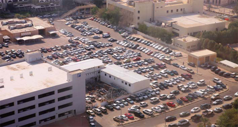 KUWAIT: Vehicles overflow parking lots and left in no parking zones in Kuwait City. The lack of road expansion projects that accommodate with the rapid growth of construction ventures in the nation’s capital has made finding a parking space there a daily struggle. — Photos by Yasser Al-Zayyat
