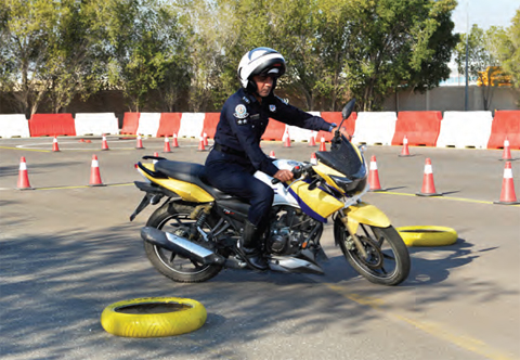 An officer demonstrates motorbike training techniques at Kuwait Motoring Company’s new testing area.