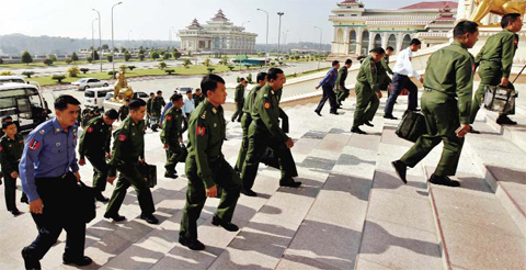 NAYPYITAW: Myanmar military lawmakers arrive to attend the final session of Myanmar’s current parliament as it ends its five-year term in Naypyitaw, Myanmar. — AP