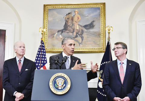 WASHINGTON: US President Barack Obama delivers a statement on the Guantanamo Bay detention camp flanked by US Vice President Joe Biden (left) and Defense Secretary Ashton Carter yesterday in the Roosevelt Room of the White House. - AFP 