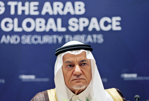 ABU DHABI: Former director of the Saudi Arabia General Intelligence Directorate Prince Turki bin Faisal Al Saud, and a member of the board of the Beirut Institute, talks during a press conference yesterday. — AP