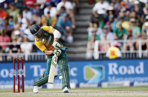 JOHANNESBURG: South African  batsman AB de Villiers swings for the ball during the second T20 cricket match between South Africa and England at the Wanderers stadium in Johannesburg yesterday. – AFP