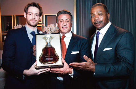 Frank Larrazaleta presents a bottle of Hennessy Paradis Imperial to ‘Creed’ star Sylvester Stallone after he received the prestigious Montecito Award presented by actor Carl Weathers during the 31st Santa Barbara International Film Festival. — AP photos