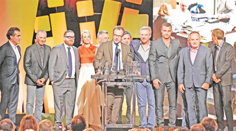 (L-R) Actor Brian d’Arcy James, actor Michael Keaton, actor Michael Cyril Creighton, actor Rachel McAdams, casting director Kenny Barden, writer/director Tom McCarthy, actor Mark Ruffalo, actor Jamey Sheridan, actor Liev Schreiber, actor Paul Guilfoyle, and actor Neail Huff accept the Robert Altman Award for “Spotlight” onstage during the 2016 Film Independent Spirit Awards. — AFP