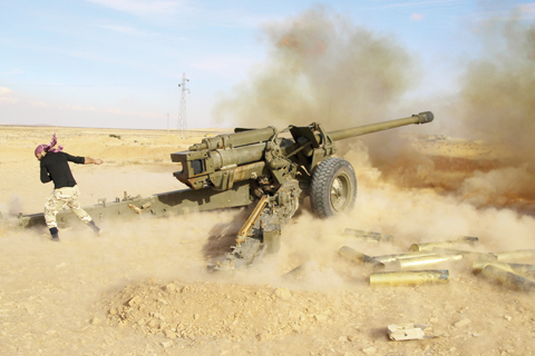 MAHIN: Syrian government troops fire at Islamic State group positions near Mahin, Syria. The nearly five-year Syrian conflict has left at least 250,000 people dead, forced millions to flee the country and given an opening to the Islamic State group to capture territory in Syria and Iraq. — AP