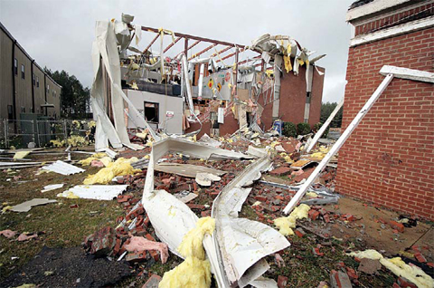 LAUDERDALE: Debris lies on the ground near First Baptist Church of Collinsville in Lauderdale County, Miss after it was severely damaged during a storm. —AP