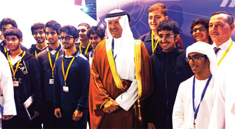 ABU DHABI: Saudi Arabia’s Prince Sultan bin Salman stands for pictures with a group of young Arab students at the Global Aerospace Summit. — AP