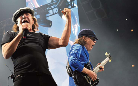 In this file photo, Brian Johnson, left, and Angus Young perform with AC/DC on the Rock or Bust Tour in Chicago. — AP