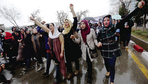 KABUL: In this file photo, Afghan women chant slogans during a protest demanding justice for a woman who was beaten tondeath by a mob after being falsely accused of burning a Quran in downtown of Kabul. — AP
