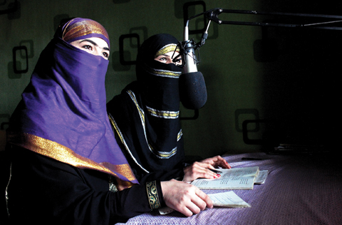 In this photo, broadcasters of Radio Shaesta prepare themselves to go on-air, in Kunduz, Afghanistan.