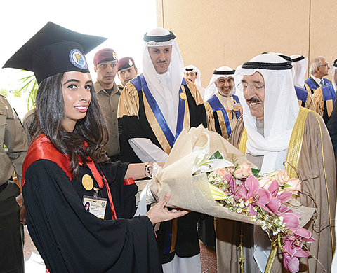 His Highness the Amir Sheikh Sabah Al-Ahmad Al- Jaber Al-Sabah receives flowers from one of the graduating students