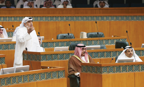 T: MP Adnan Abdulsamad speaks during a parliament session yesterday, as Foreign Minister Sheikh Sabah Al-Khaled Al-Sabah (center) and Justice Minister Yaqoub Al-Sane look on. — Photo by Yasser Al-Zayyat