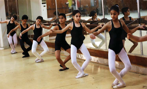 Students practice ballet at the Baghdad School of Music and Ballet in the Iraqi capital.