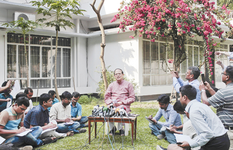 DHAKA: Bangladesh Bank Governor Atiur Rahman, who resigned yesterday, addresses a press conference yesterday. - AP 