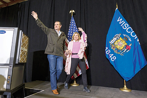 DANE: Republican presidential candidate, Sen. Ted Cruz, R-Texas and wife Heidi walk on stage before the candidate spoke at a campaign stop.-AP