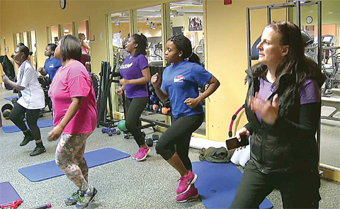 BOSTON: In this still photo from video, Gibbs Saunders, right, managing director of the nonprofit Healthworks Community Fitness, exercises with clients at their gym in the Boston neighborhood of Dorchester. —AP photos