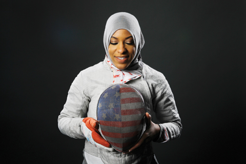 Fencer Ibtihaj Muhammad poses for photos at the 2016 Olympic Team USA media summit in Beverly Hills, Calif. Muhammad would be the first American to compete in the Olympics wearing a hijab. — AP
