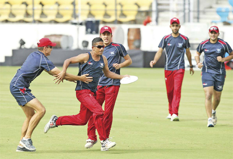 NAGPUR: Hong Kong cricketers take part in a training session ahead of the forthcoming Cricket World Cup T20 tournament at the Vidarbha Cricket Association Stadium in Nagpur yesterday. — AFP