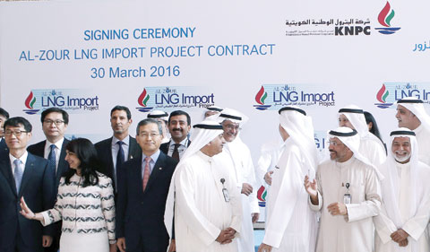 KUWAIT: Representatives of the Kuwait National Petroleum Company (KNPC) and South Korean representatives of the Hyundai Engineering and Construction (HDEC) pose for a family photo after signing an agreement as part of a Liquefied Natural Gas import project yesterday at the KNPC headquarters in Al-Ahmadi. — Photo by Yasser Al-Zayyat